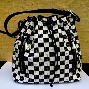 L.A.M.B. Black and white bucket bag.